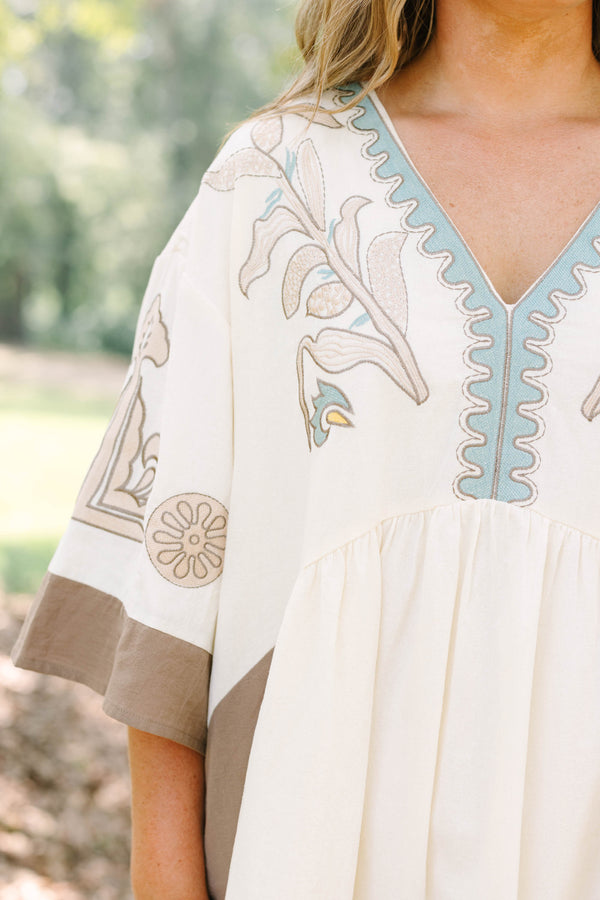 Plus Size cream and brown cotton dress with embroidered V-neckline and loose, wide sleeves.