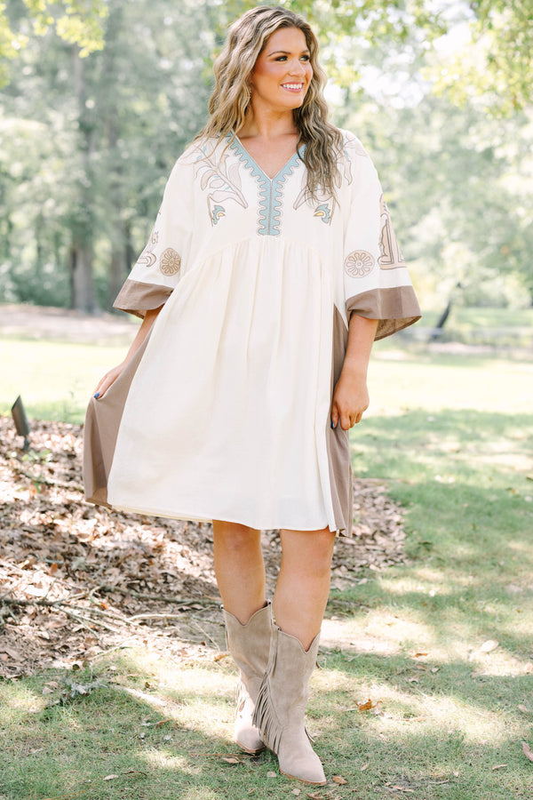 Plus Size cream and brown cotton dress with embroidered V-neckline and loose, wide sleeves.