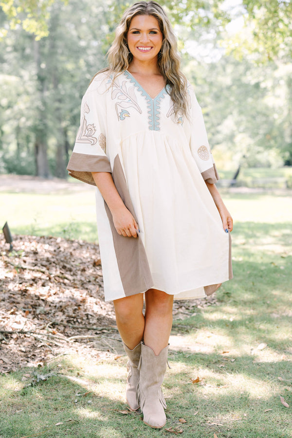 Plus Size cream and brown cotton dress with embroidered V-neckline and loose, wide sleeves.