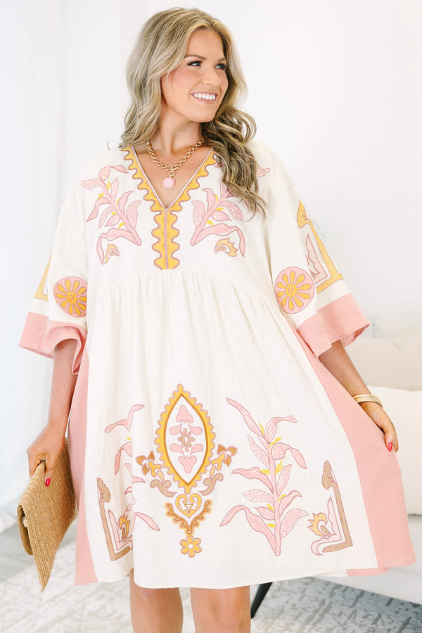 Plus Size light pink and cream V-neck dress with floral embroidery and wide sleeves.