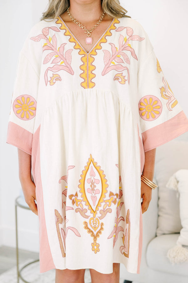Plus Size light pink and cream V-neck dress with floral embroidery and wide sleeves.