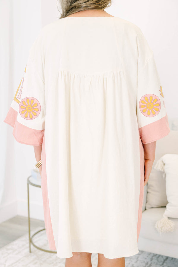 Plus Size light pink and cream V-neck dress with floral embroidery and wide sleeves.
