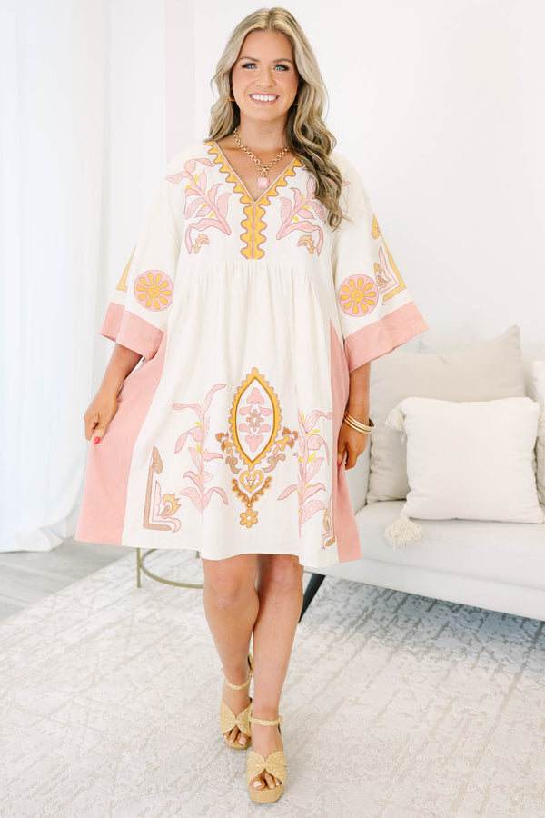 Plus Size light pink and cream V-neck dress with floral embroidery and wide sleeves.