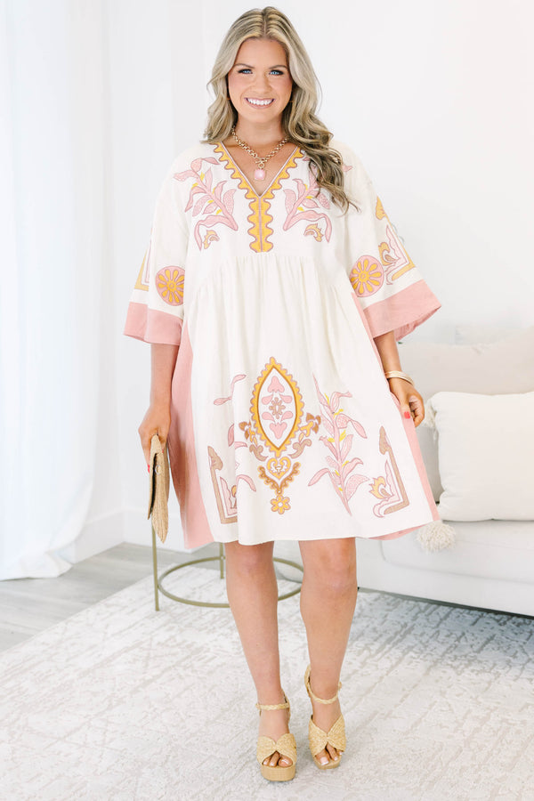 Plus Size light pink and cream V-neck dress with floral embroidery and wide sleeves.