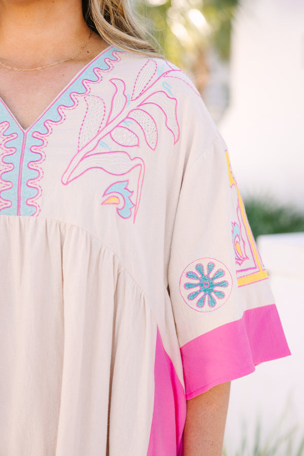 Chic Soul plus size clothing, white short sleeve mini sundress with v neckline with pink detail along bottom of sleeves with pink along the sides with yellow/blue embroidery along chest