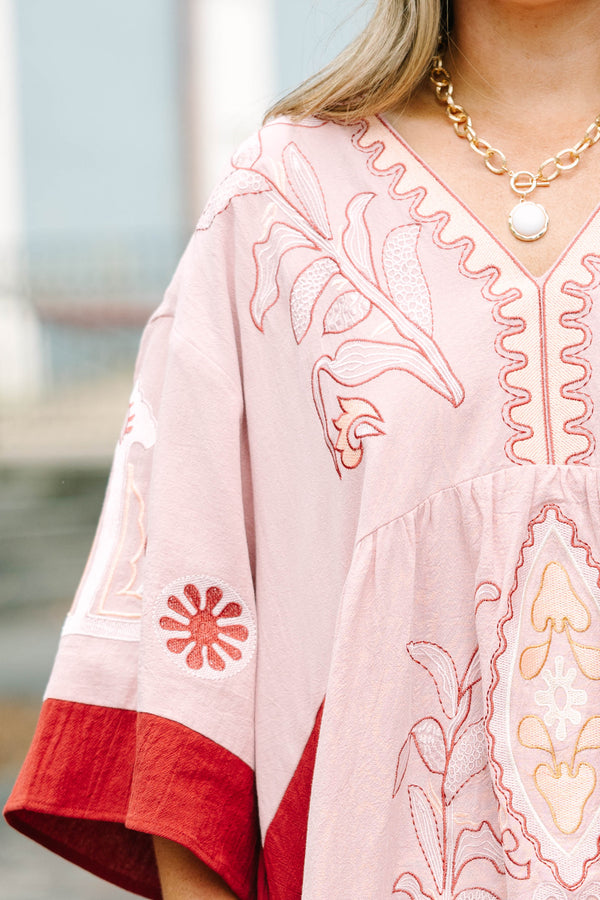 Plus Size pink blush and rust colorblock babydoll dress with intricate embroidery and wide sleeves.