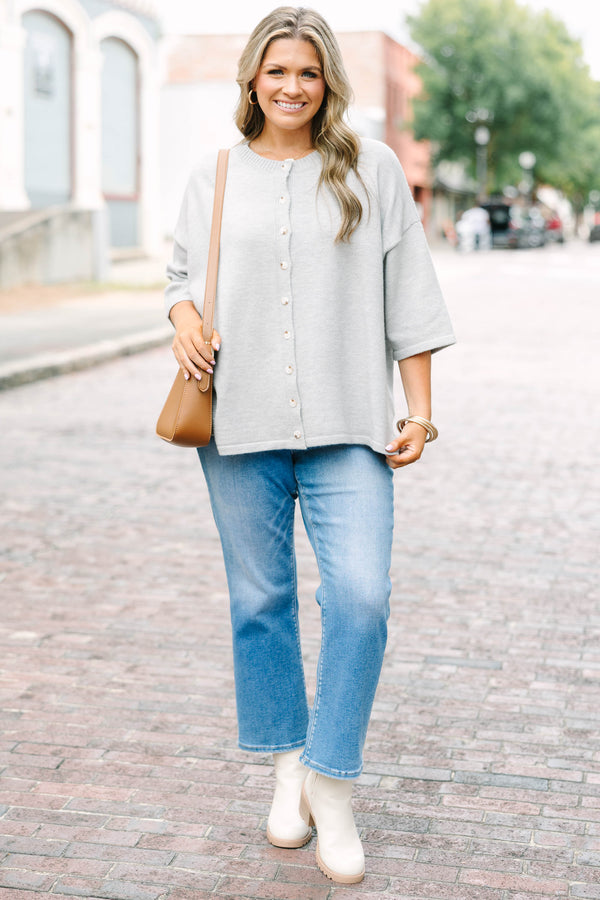 Plus Size heather gray knit cardigan with a round neckline, button-down front, and 3/4 sleeves.