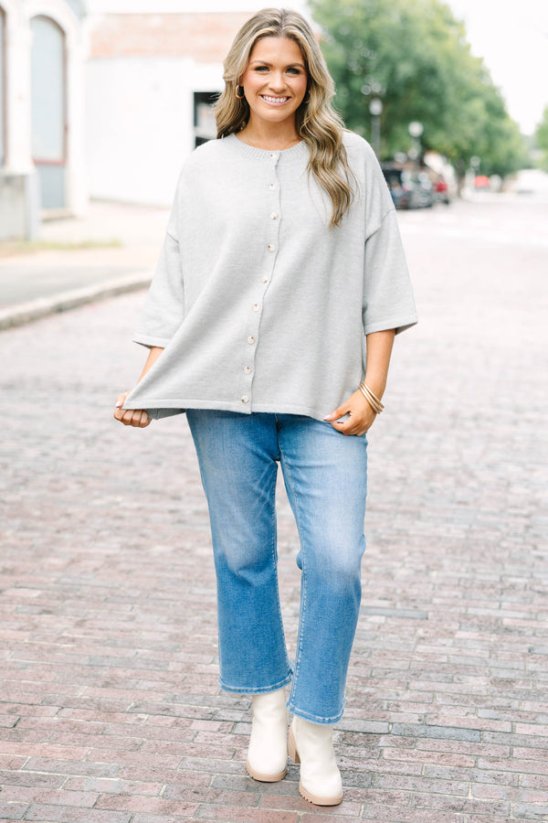 Plus Size heather gray knit cardigan with a round neckline, button-down front, and 3/4 sleeves.