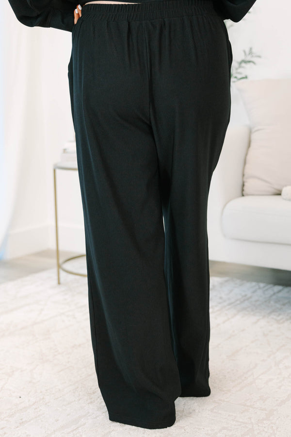 Plus Size black ribbed loungewear set featuring a long sleeve crewneck top and wide-leg pants.