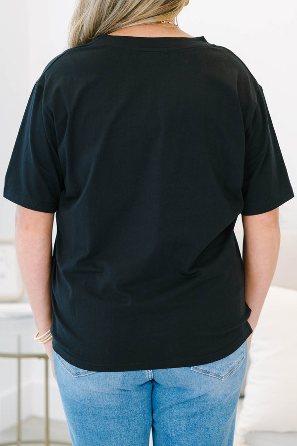 Plus Size black short sleeve V-neck t-shirt with a relaxed fit, paired with blue jeans.