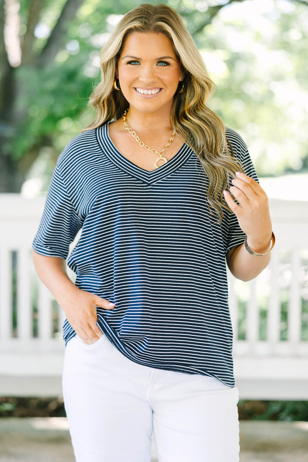 Plus Size navy and white horizontal striped V-neck top with short sleeves and a relaxed fit.