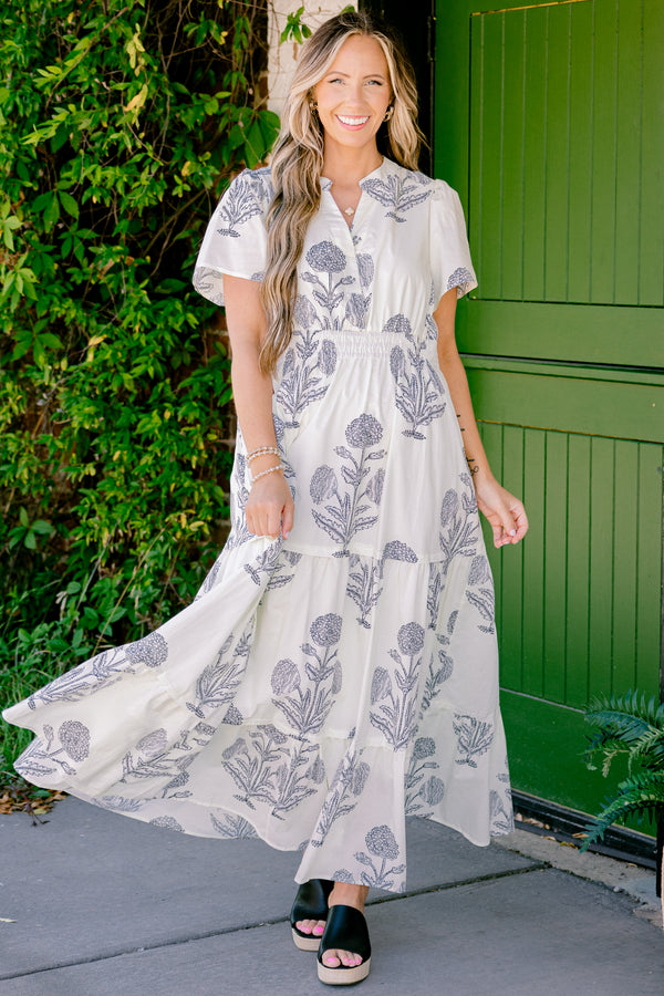 Chic Soul plus size clothing, short sleeve cream and black maxi dress with a floral pattern and a slight v-neckline 
