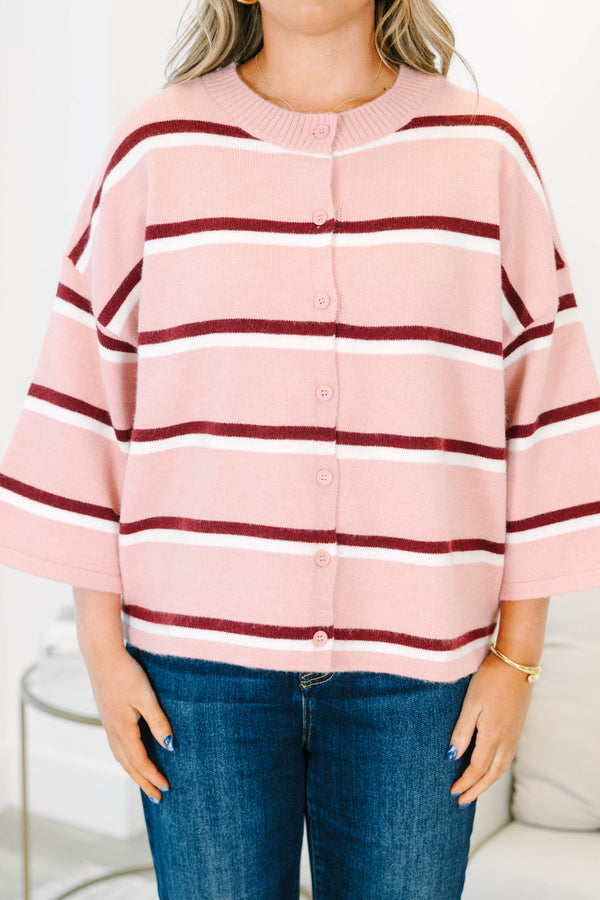 Plus size pink striped cardigan with a relaxed fit, button-down front, and soft knit fabric.