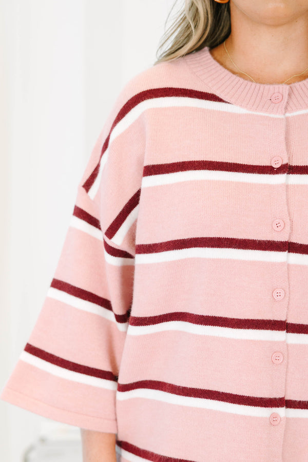 Plus size pink striped cardigan with a relaxed fit, button-down front, and soft knit fabric.
