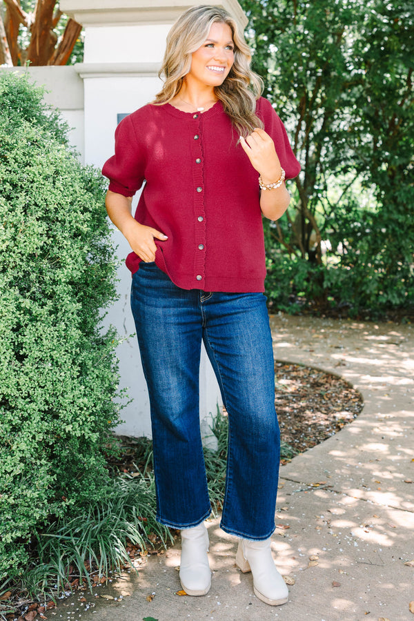 Plus Size burgundy knit cardigan with short puff sleeves and scalloped button placket.