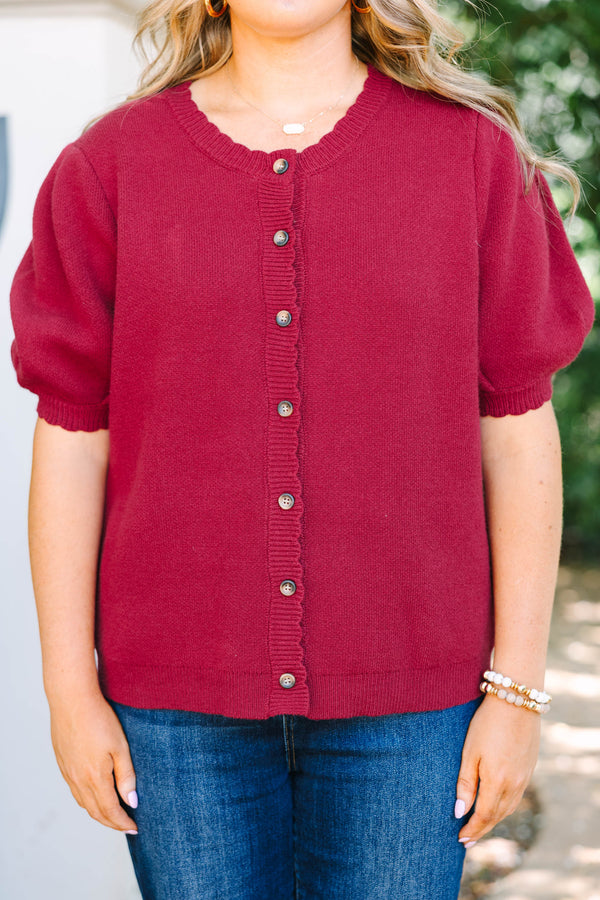 Plus Size burgundy knit cardigan with short puff sleeves and scalloped button placket.