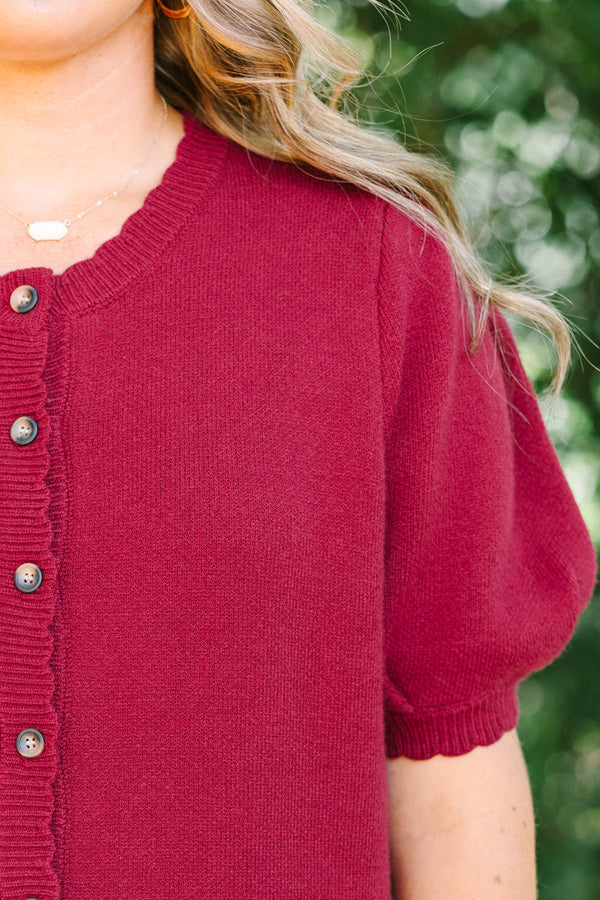 Plus Size burgundy knit cardigan with short puff sleeves and scalloped button placket.