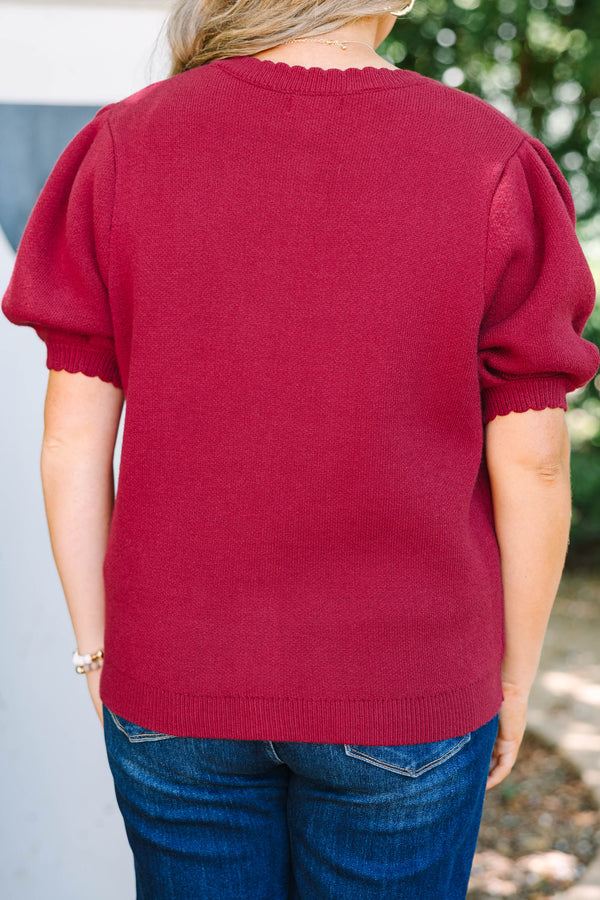 Plus Size burgundy knit cardigan with short puff sleeves and scalloped button placket.
