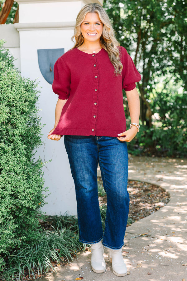 Plus Size burgundy knit cardigan with short puff sleeves and scalloped button placket.