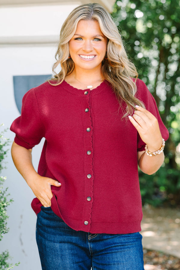 Plus Size burgundy knit cardigan with short puff sleeves and scalloped button placket.