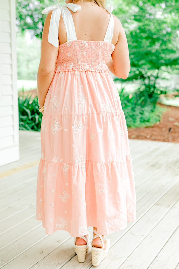 Chic Soul Plus size clothing, pink tiered mid dress with embroidered white bow details and bows that tie on top of the shoulders 
