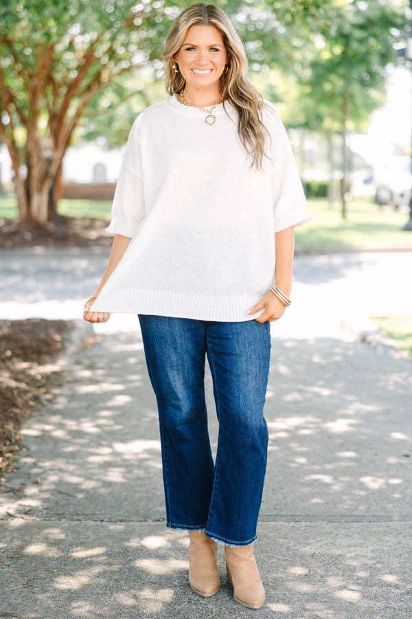 Plus size short-sleeve knit sweater top with a relaxed fit.