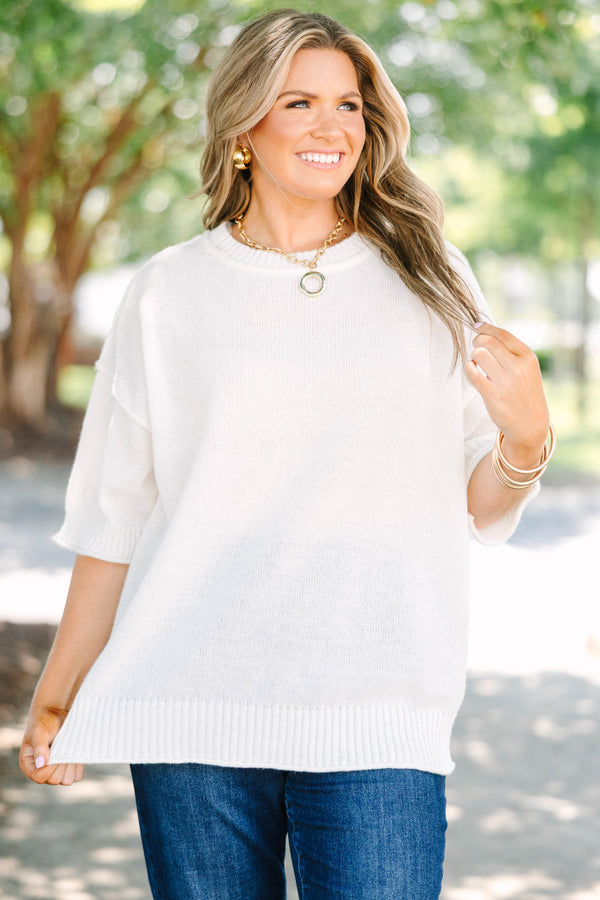 Plus size short-sleeve knit sweater top with a relaxed fit.