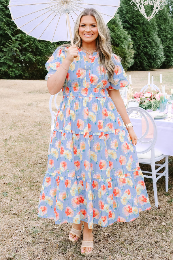 Chic Soul plus size clothing, blue tiered maxi dress with flutter sleeves that have two scalloped ruffle as well as sinching waistband a slight v-neckline and multi color flora pattern throughout 