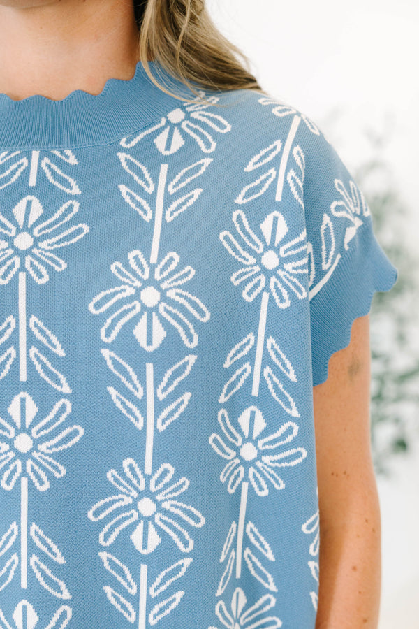 Plus Size slate blue short sleeve sweater with a white floral pattern and scalloped neckline.