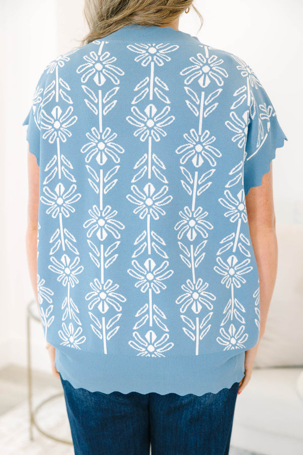 Plus Size slate blue short sleeve sweater with a white floral pattern and scalloped neckline.