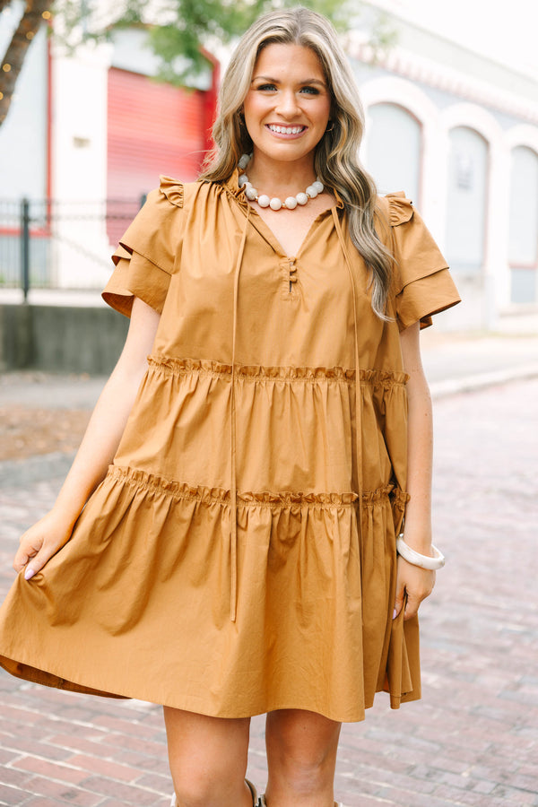 Plus Size tiered brown babydoll dress with flutter sleeves, a ruffled neckline, and tie details.