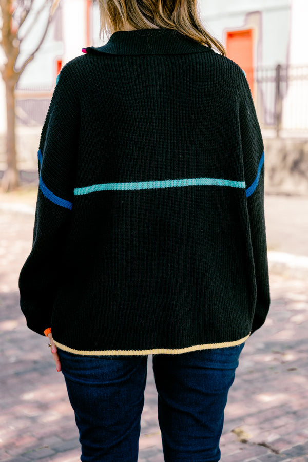 Plus Size black knit quarter-zip sweater with vibrant multi-colored piping and orange cuffs.