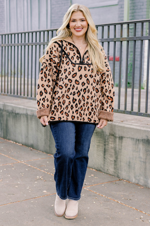 Chic Soul plus size clothing, leopard long sleeve that has a zipper going down to the chest as well has black stitching details around the bottom of the sweater and along the neckline 