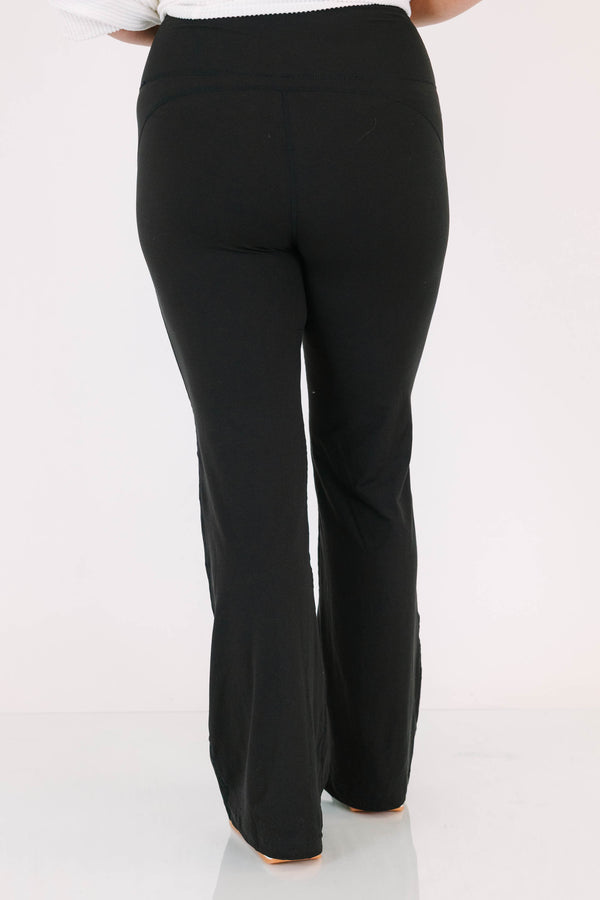 Plus Size black flare leggings in a butter soft fabric with a high-waisted fit.