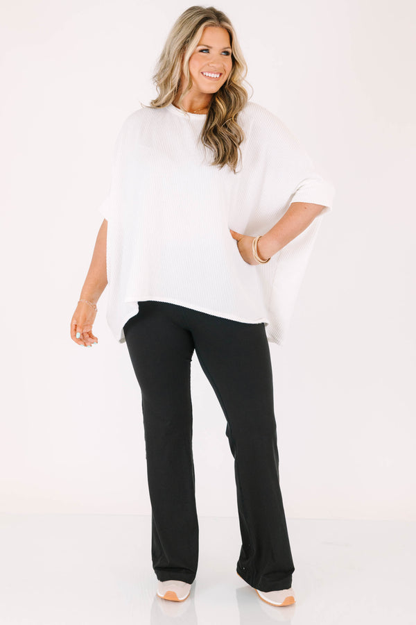 Plus Size black flare leggings in a butter soft fabric with a high-waisted fit.