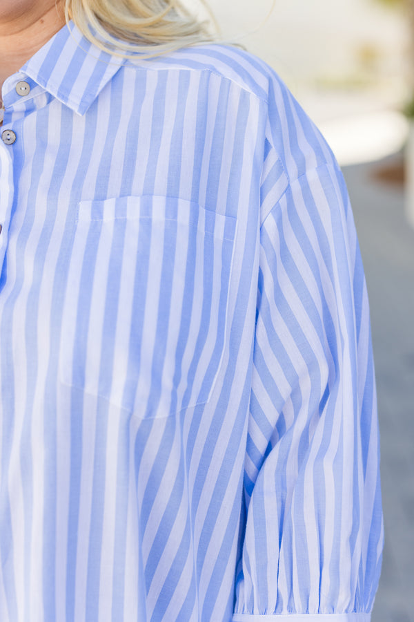 Chic Soul plus size clothing, blue long sleeve striped top that has buttons going down the center of the top as well as ruffle details at the bottom of the shirt and a collar 