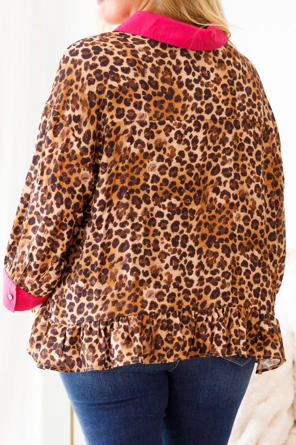 Chic Soul plus size clothing, leopard top with pink details at the end of each sleeve and going down the center of the blouse also ruffle details at the bottom of the top 