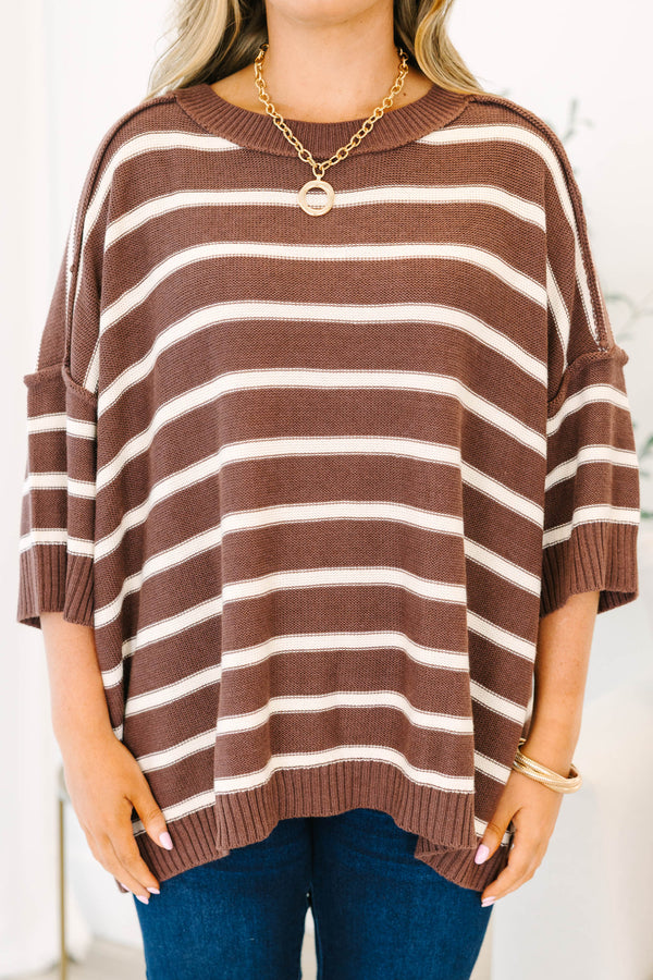 Plus Size brown and white horizontal striped oversized sweater with elbow-length sleeves.