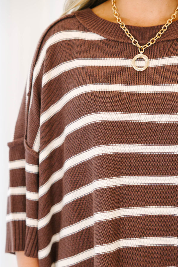 Plus Size brown and white horizontal striped oversized sweater with elbow-length sleeves.
