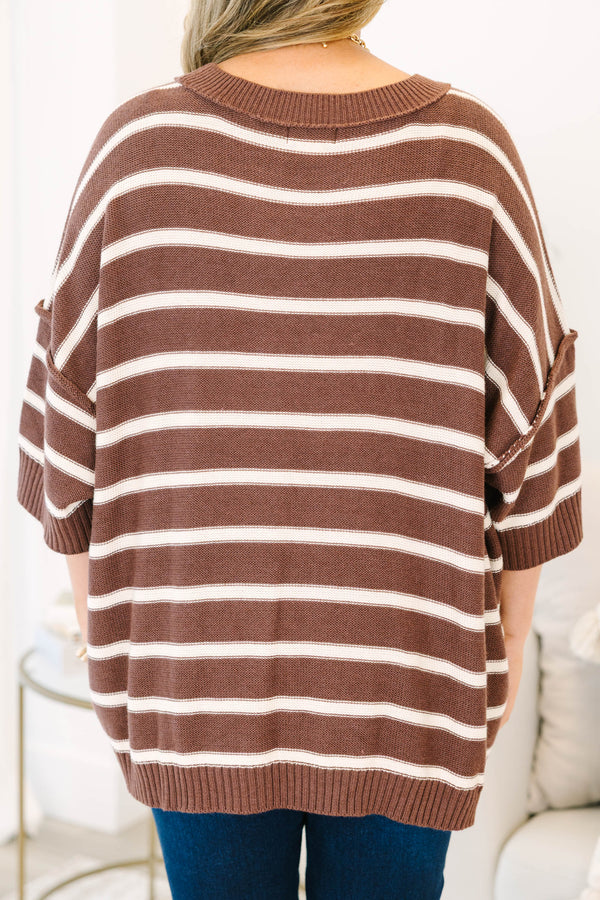 Plus Size brown and white horizontal striped oversized sweater with elbow-length sleeves.