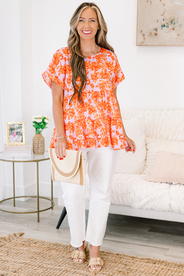 Chic Soul plus size clothing, orange short sleeve babydoll top with a light pink abstract pattern 
