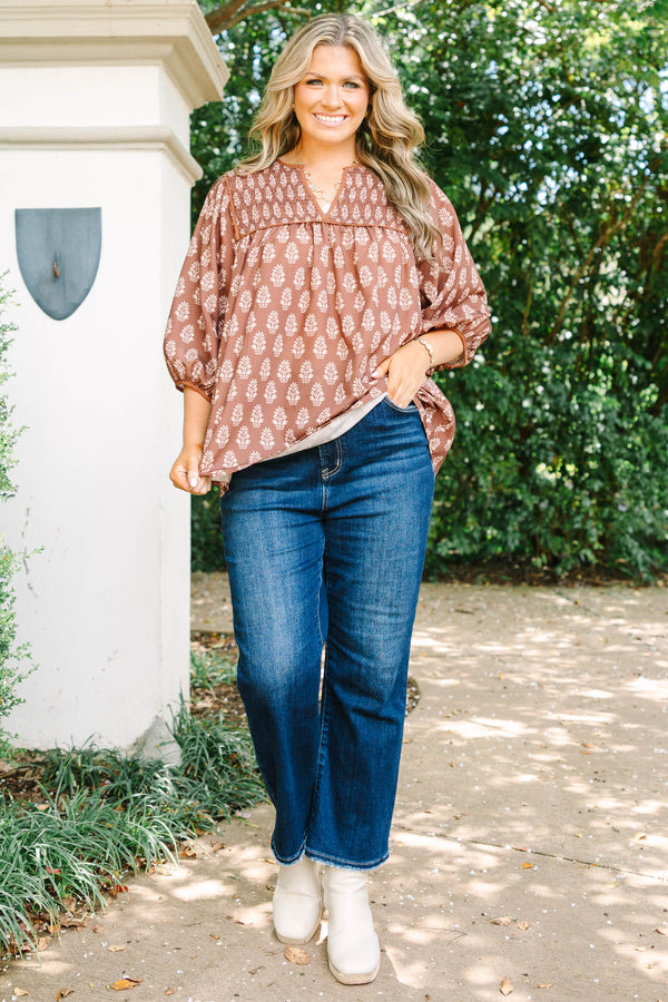 Plus Size brown floral print top with smocked yoke, V-neckline, and balloon sleeves.