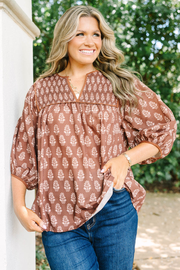Plus Size brown floral print top with smocked yoke, V-neckline, and balloon sleeves.