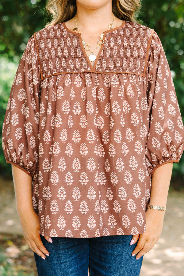 Plus Size brown floral print top with smocked yoke, V-neckline, and balloon sleeves.
