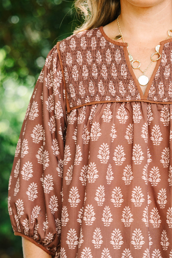 Plus Size brown floral print top with smocked yoke, V-neckline, and balloon sleeves.