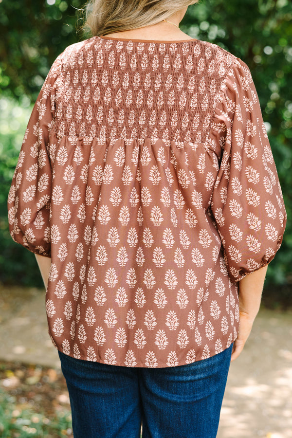 Plus Size brown floral print top with smocked yoke, V-neckline, and balloon sleeves.