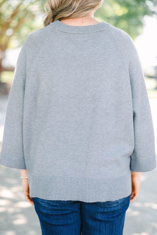 Plus Size gray crewneck sweater with wide three-quarter length sleeves and a ribbed hem.