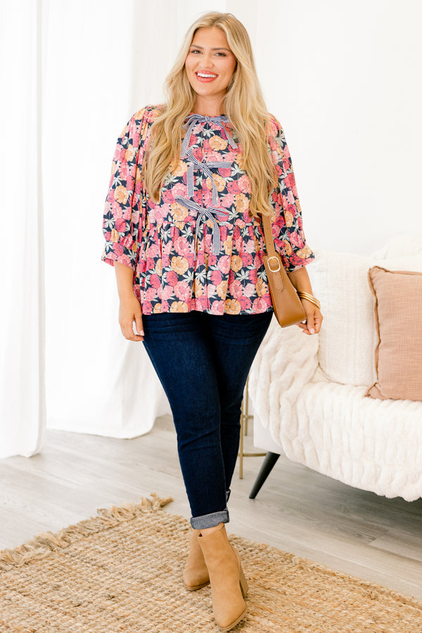Chic Soul plus size clothing, light pink and orange floral pattern on navy three-quarter balloon sleeve high neck babydoll top with three navy and white pinstripe bows on front