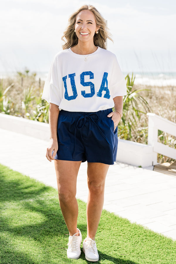 Chic Soul plus size clothing, short-sleeve off-white top with a high-scoop-neckline and a blue distressed graphic lettering stating 