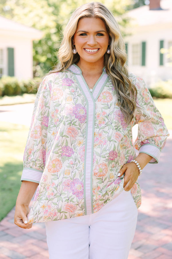Plus size green floral V-neck top with striped trim and flowy 3/4 sleeves